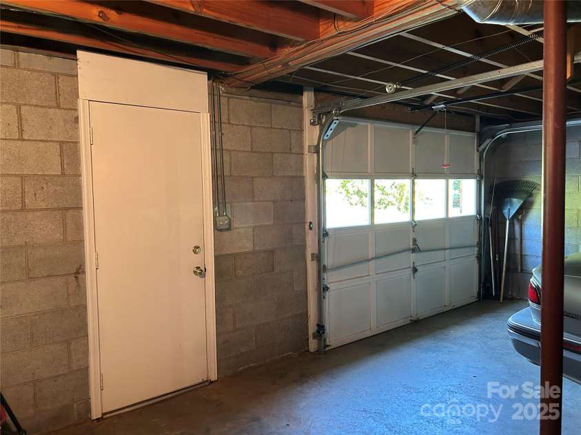 18 Sheppard Drive, Asheville, NC 28806.  MLS# CAR4269350, YatesRealty ID 29015. Walkout Basement/Garage Door