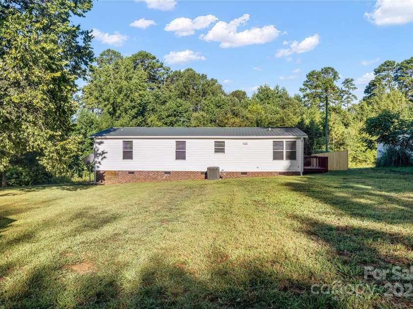 7050 Woodleaf Road, Woodleaf, NC 27054.  MLS# CAR4276614, YatesRealty ID 29035. Back Yard 1.56 Acre Lot