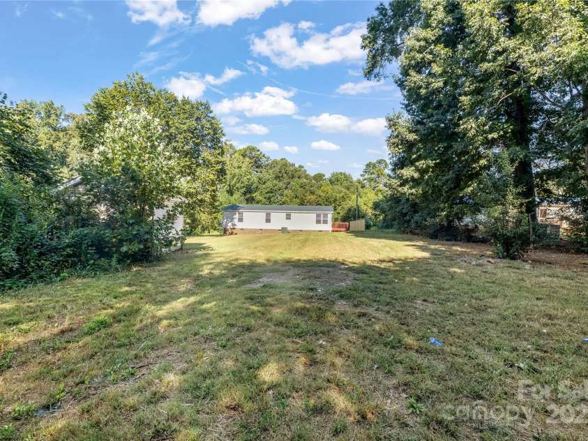 7050 Woodleaf Road, Woodleaf, NC 27054.  MLS# CAR4276614, YatesRealty ID 29035. Back Yard 1.56 Acre Lot