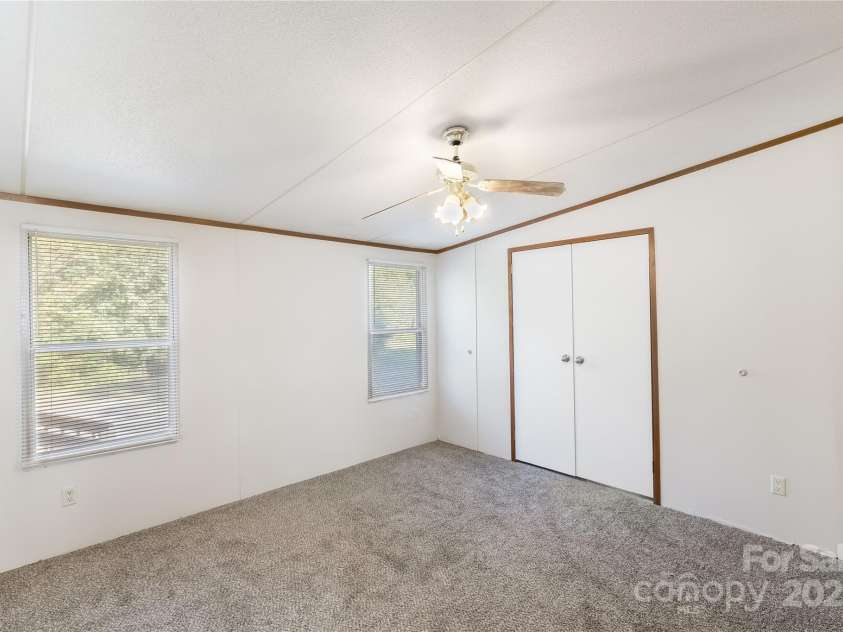 7050 Woodleaf Road, Woodleaf, NC 27054.  MLS# CAR4276614, YatesRealty ID 29035. Primary Bedroom