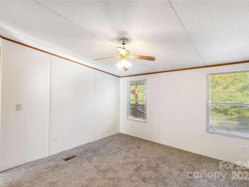 7050 Woodleaf Road, Woodleaf, NC 27054.  MLS# CAR4276614, YatesRealty ID 29035. Primary Bedroom