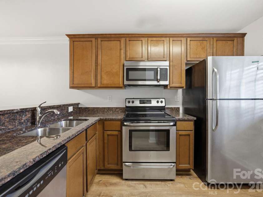1215 Green Oaks Lane, Charlotte, NC 28205.  MLS# CAR4387750, YatesRealty ID 29037. Kitchen w/ stainless appliance package