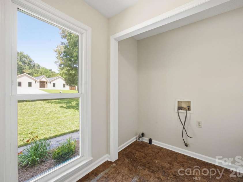 2011 Windlock Drive, Charlotte, NC 28270.  MLS# CAR4362953, YatesRealty ID 29038. Laundry Area By Garage2011 Windlock DrCharlotte, NC 28270
