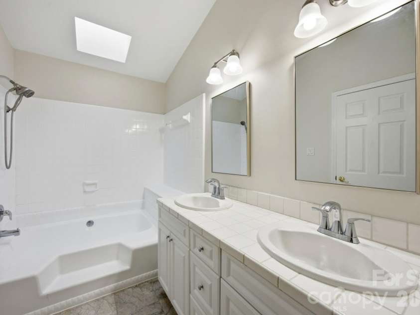 2011 Windlock Drive, Charlotte, NC 28270.  MLS# CAR4362953, YatesRealty ID 29038. Owners Bath with tile flooring2011 Windlock DrCharlotte, NC 28270