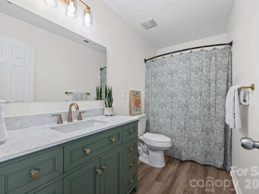 232 Sycamore Creek Road, Fort Mill, SC 29708.  MLS# CAR4385566, YatesRealty ID 29042. The upper level includes a spacious shared full bath with a beautifully updated vanity and fixtures, offering a refreshing, upscale vibe you'll genuinely look forward to getting ready in each morning.