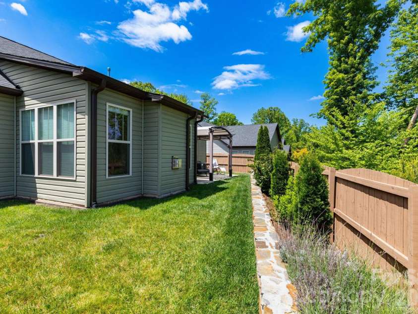 407 Bell Lily Drive, Weaverville, NC 28787.  MLS# CAR4379764, YatesRealty ID 29045. Side Yard