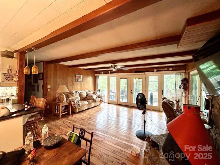 12 Elk Way, Maggie Valley, NC 28751.  MLS# CAR4286443, YatesRealty ID 29051. Living area/Patio doors to deck