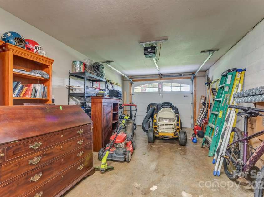 230 Fairway Falls Road, Mills River, NC 28759.  MLS# CAR4256641, YatesRealty ID 29061. Basement Garage for Golf Cart, Lawn Mower and large storage area.