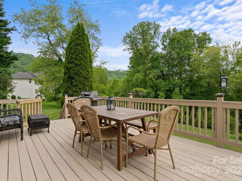 230 Fairway Falls Road, Mills River, NC 28759.  MLS# CAR4256641, YatesRealty ID 29061. Deck that spans the entire length of the home