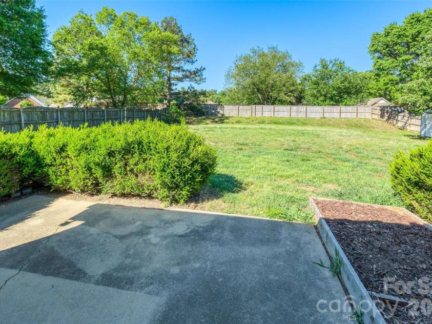 4313 Atkinson Way, Monroe, NC 28110.  MLS# CAR4377451, YatesRealty ID 29064. Back Patio with Yard View