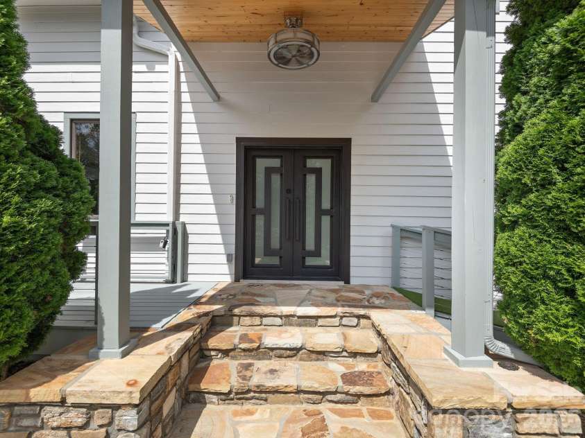 248 Wisdom Cove Road, Flat Rock, NC 28731.  MLS# CAR4357941, YatesRealty ID 29067. Solid Wrought Iron double door.