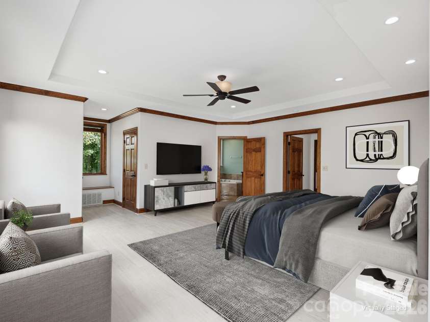 248 Wisdom Cove Road, Flat Rock, NC 28731.  MLS# CAR4413753, YatesRealty ID 29067. Primary Bedroom w/Ensuite. Access to screen porch. Virtually staged.