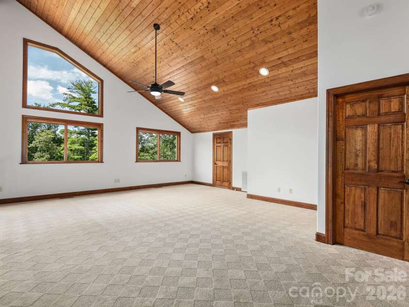 248 Wisdom Cove Road, Flat Rock, NC 28731.  MLS# CAR4413753, YatesRealty ID 29067. Upper Level Loft area. Door in foreground is to upper level second primary w/attached ensuite.