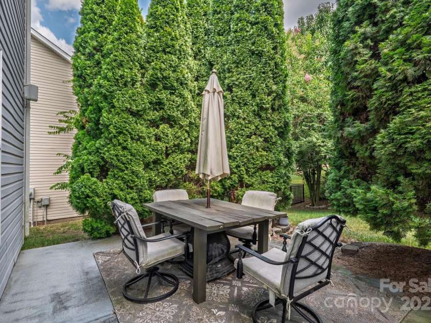 10121 Halkirk Manor Lane, Charlotte, NC 28278.  MLS# CAR4277105, YatesRealty ID 29068. Mature trees provide privacy to enjoy the backyard.
