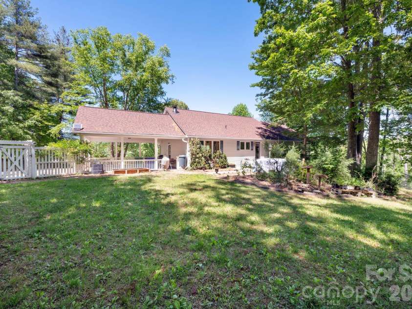 43 Charles Marlowe Drive, Fairview, NC 28730.  MLS# CAR4385183, YatesRealty ID 29070. Level fenced backyard with a hot tub.
