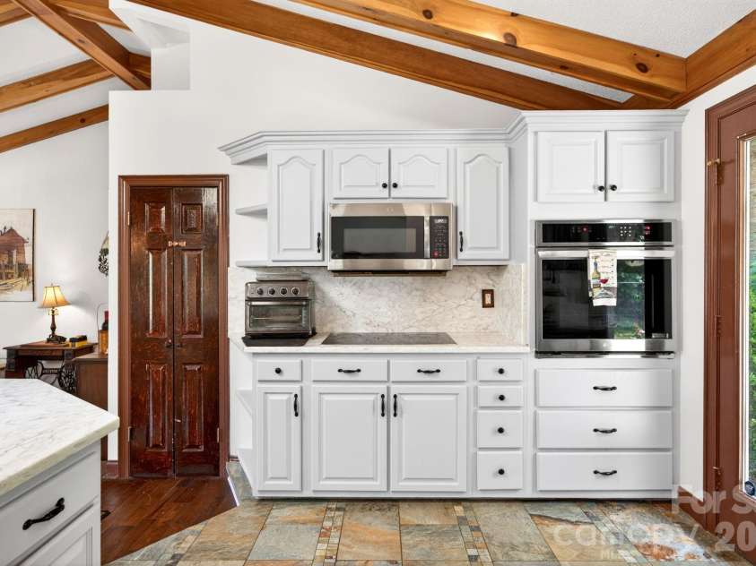 43 Charles Marlowe Drive, Fairview, NC 28730.  MLS# CAR4385183, YatesRealty ID 29070. Pantry to the left, backyard to the right.
