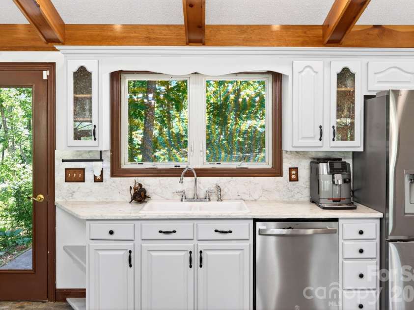 43 Charles Marlowe Drive, Fairview, NC 28730.  MLS# CAR4385183, YatesRealty ID 29070. Window sink to the fenced backyard