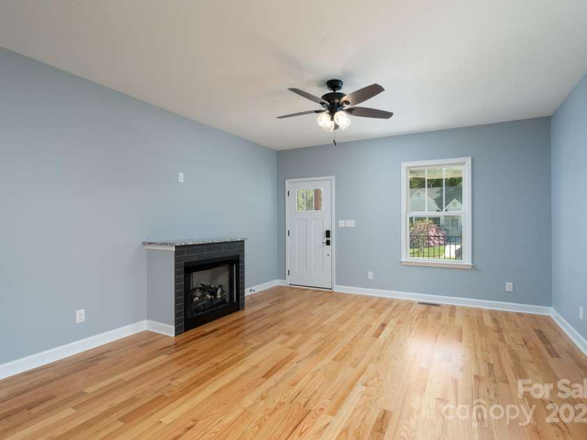 406 Williamson Street, Fort Mill, SC 29715.  MLS# CAR4242918, YatesRealty ID 29072. Front door with fireplace