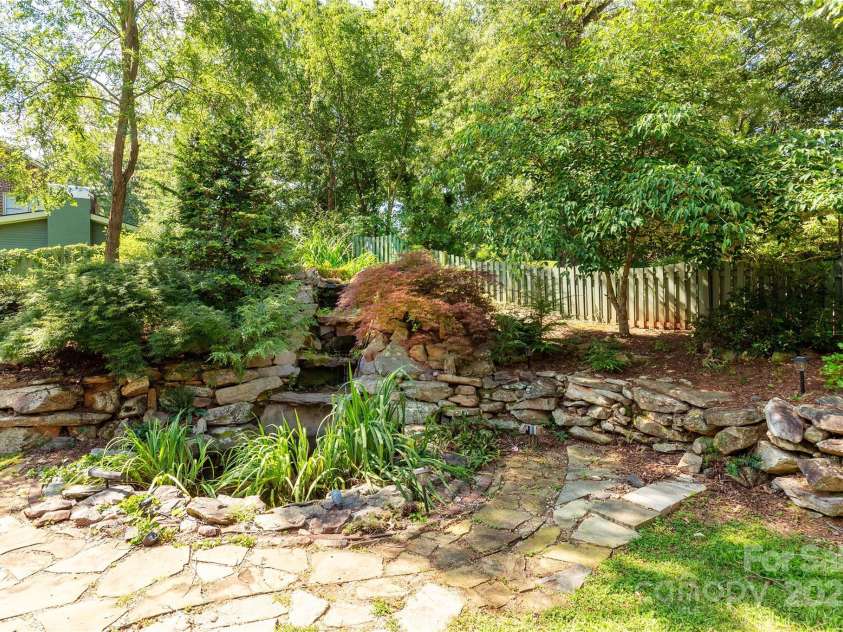 32 Pine Acre Boulevard, Asheville, NC 28804.  MLS# CAR4283589, YatesRealty ID 29077. Backyard private oasis with waterfall!
