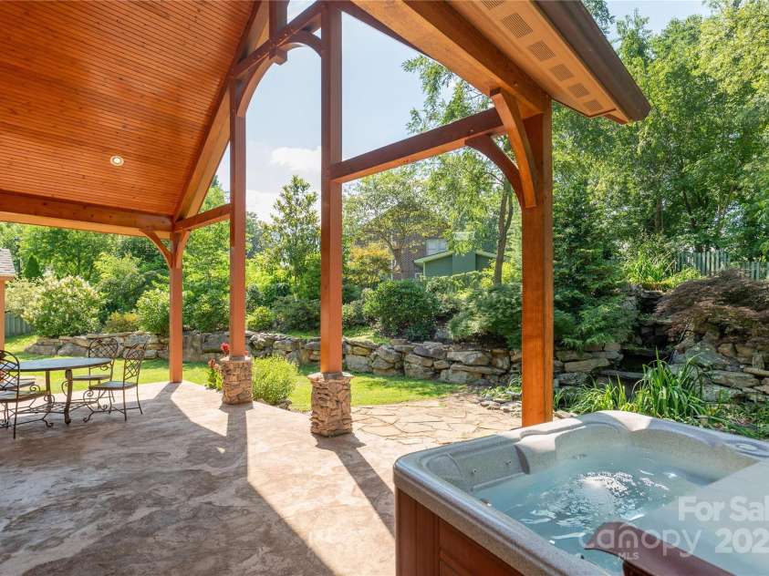 32 Pine Acre Boulevard, Asheville, NC 28804.  MLS# CAR4283589, YatesRealty ID 29077. Feel the peace sitting in the hot tub and listening to the waterfall!
