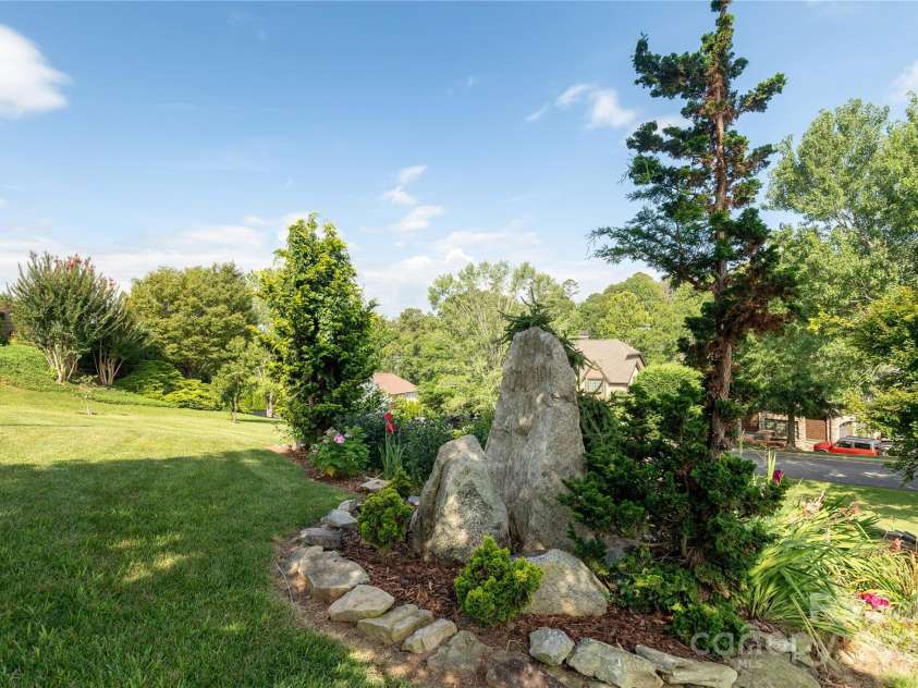 32 Pine Acre Boulevard, Asheville, NC 28804.  MLS# CAR4283589, YatesRealty ID 29077. Mature landscaping at every turn!