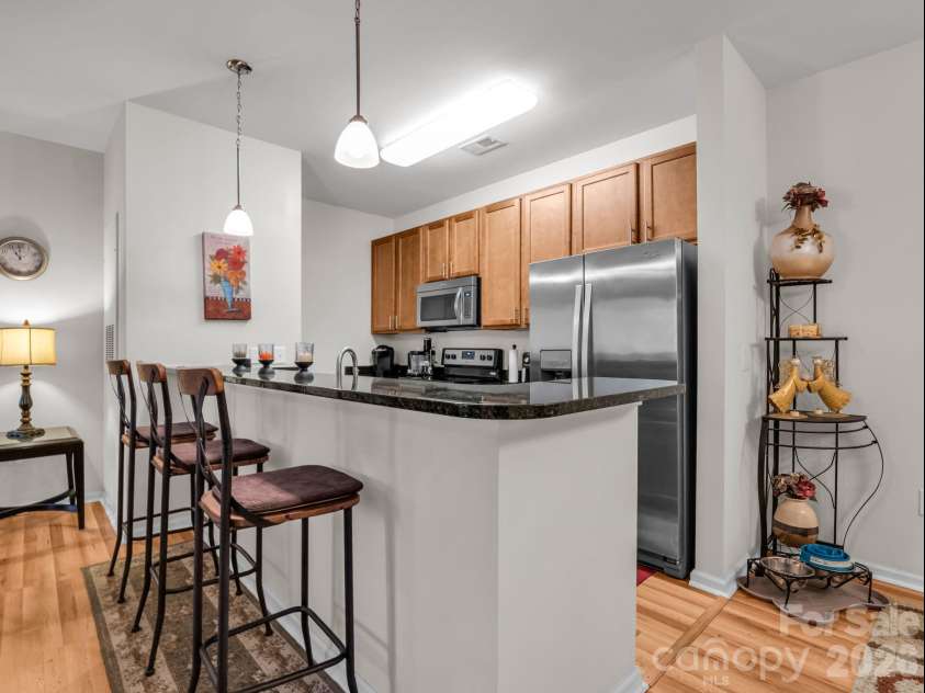 91 Brickton Village Circle, Fletcher, NC 28732.  MLS# CAR4370320, YatesRealty ID 29077. Breakfast bar seats 4
