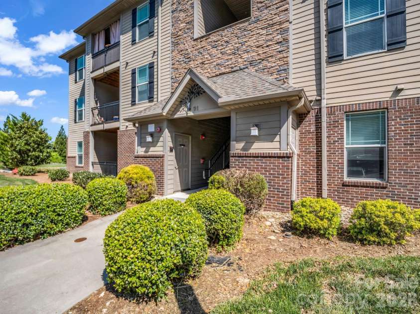91 Brickton Village Circle, Fletcher, NC 28732.  MLS# CAR4370320, YatesRealty ID 29077. Use first entry when driving up to bldg