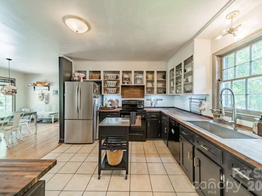 7116 Sherbourne Drive, Charlotte, NC 28210.  MLS# CAR4383410, YatesRealty ID 29084. Open kitchen with butcher block countertops