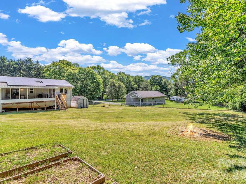 13 Spring Lake Drive, Fletcher, NC 28732.  MLS# CAR4371946, YatesRealty ID 29090. Level yard for pets, gardening, activities
