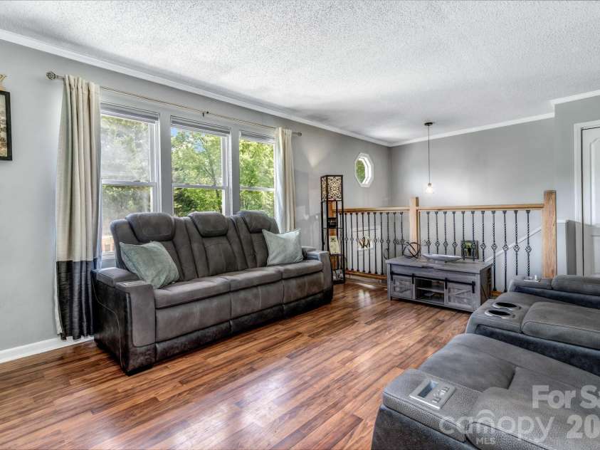 13 Spring Lake Drive, Fletcher, NC 28732.  MLS# CAR4371946, YatesRealty ID 29090. Open living room