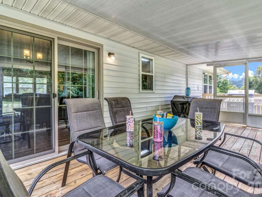 13 Spring Lake Drive, Fletcher, NC 28732.  MLS# CAR4371946, YatesRealty ID 29090. Screened in porch