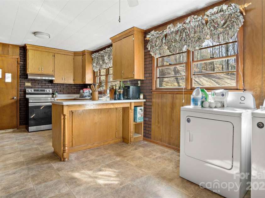 80 Robinson Holler Drive, Marion, NC 28752.  MLS# CAR4112689, YatesRealty ID 29090. Dining area and laundry.