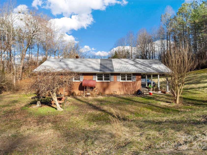 80 Robinson Holler Drive, Marion, NC 28752.  MLS# CAR4112689, YatesRealty ID 29090. Level backyard for games and get togethers.