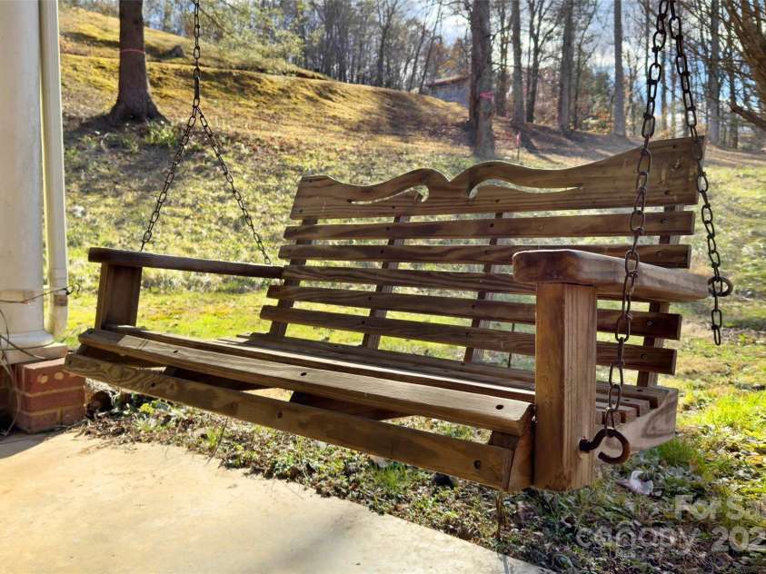 80 Robinson Holler Drive, Marion, NC 28752.  MLS# CAR4112689, YatesRealty ID 29090. Swing your stress away on this covered carport.