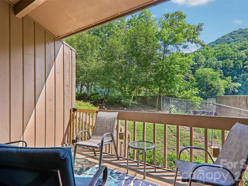 147 Lake Drive, Lake Lure, NC 28746.  MLS# CAR4385694, YatesRealty ID 29092. Back deck
