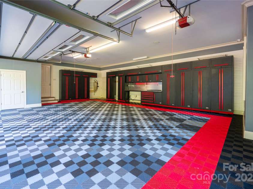 305 Mallard Drive, New London, NC 28127.  MLS# CAR4278141, YatesRealty ID 29094. Barrett-Jackson Garage Cabinet Systems and Swisstrax garage tiles flooring