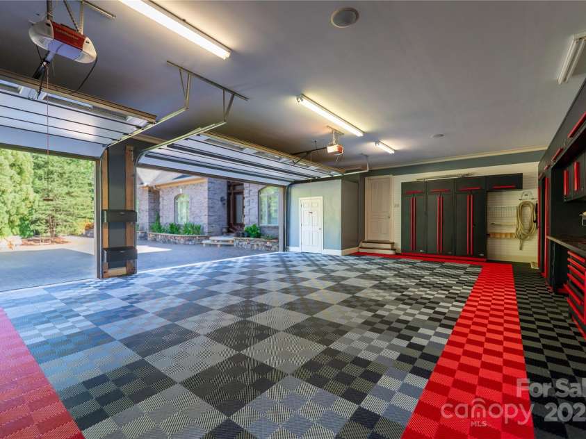 305 Mallard Drive, New London, NC 28127.  MLS# CAR4278141, YatesRealty ID 29094. Barrett-Jackson Swisstrax garage tiles