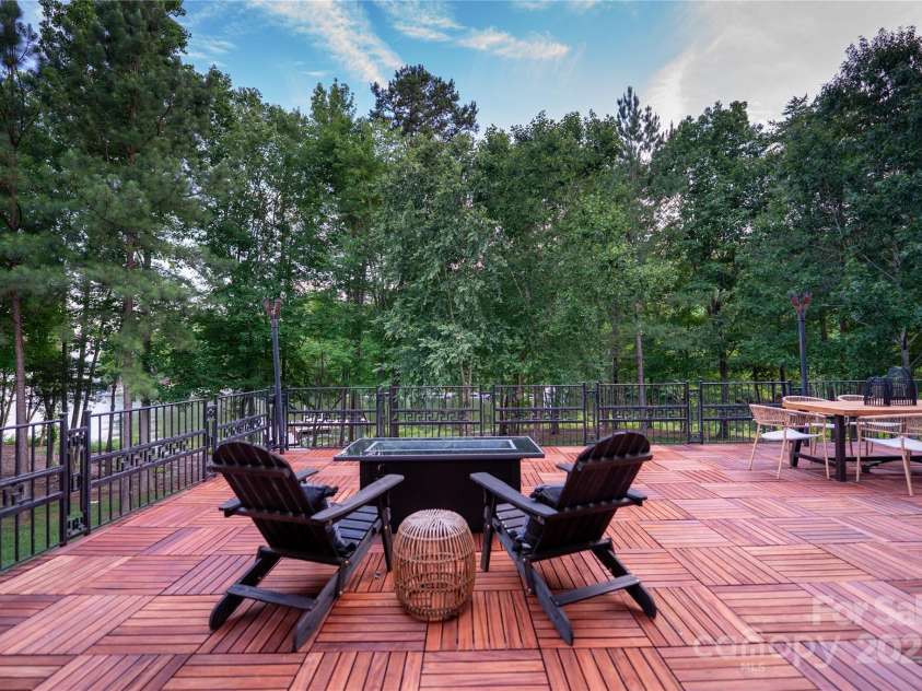 305 Mallard Drive, New London, NC 28127.  MLS# CAR4278141, YatesRealty ID 29094. Exotic Tiger Wood makes the deck pop.