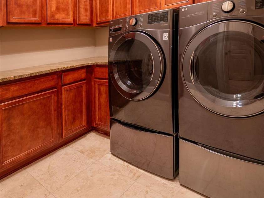 305 Mallard Drive, New London, NC 28127.  MLS# CAR4278141, YatesRealty ID 29094. Laundry room. Washer and dryer stay.Washer has a sidekick(second washer) under the main. Pulls out.