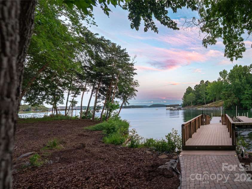 305 Mallard Drive, New London, NC 28127.  MLS# CAR4278141, YatesRealty ID 29094. Private boat dock with lift and 3 jet ski docks.