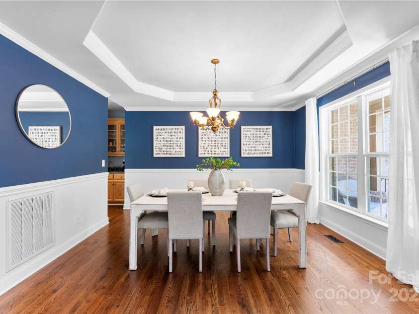 6300 Latta Springs Circle, Huntersville, NC 28078.  MLS# CAR4260746, YatesRealty ID 29101. Gorgeous dining room with tray ceiling and wainscoting