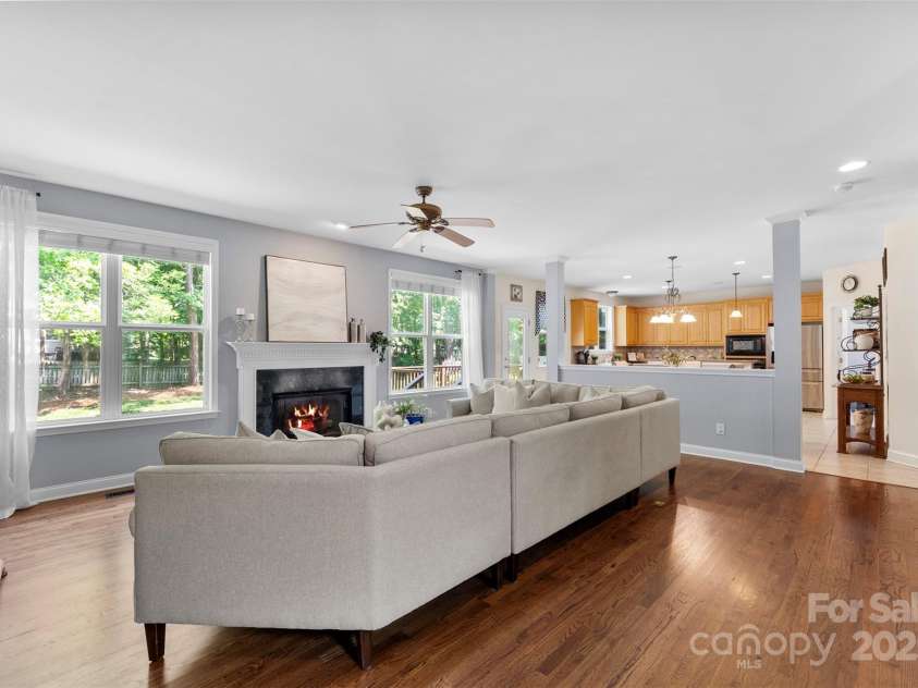 6300 Latta Springs Circle, Huntersville, NC 28078.  MLS# CAR4260746, YatesRealty ID 29101. Living room with gas fireplace and marble surround