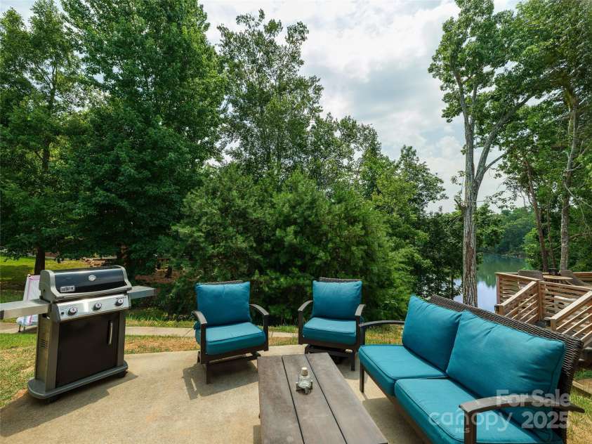 28111 Egrets Court, Lancaster, SC 29720.  MLS# CAR4277377, YatesRealty ID 29102. Back patio with lake view