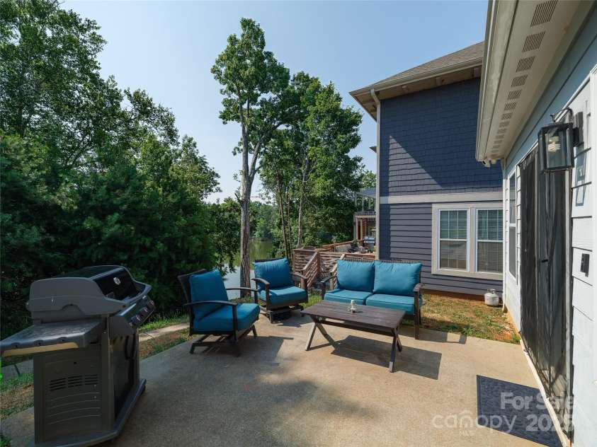 28111 Egrets Court, Lancaster, SC 29720.  MLS# CAR4277377, YatesRealty ID 29102. Back patio with lake view