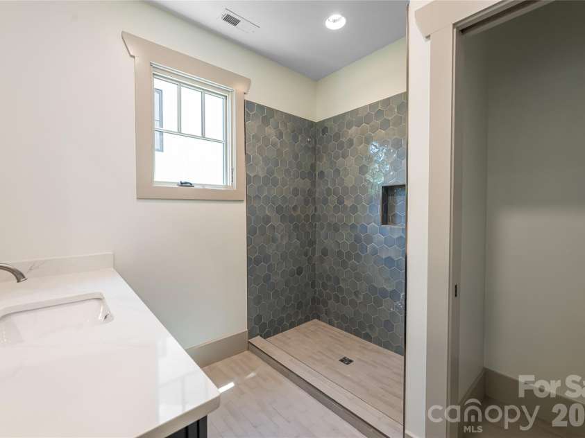 110 Unadilla Avenue, Asheville, NC 28803.  MLS# CAR4249602, YatesRealty ID 29105. Lower level bathroom