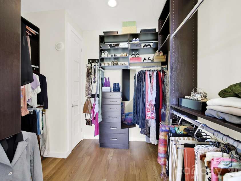 1930 Scott Avenue, Charlotte, NC 28203.  MLS# CAR4367127, YatesRealty ID 29105. Expansive primary walk-in closet with custom shelving and specialized storage.