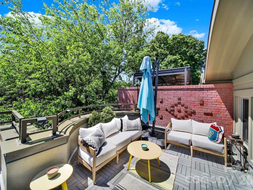 1930 Scott Avenue, Charlotte, NC 28203.  MLS# CAR4367127, YatesRealty ID 29105. Private 400 sq ft rooftop terrace with ample seating space. Front entrance and deeded private side terrace exclusive to this residence (not a shared space).