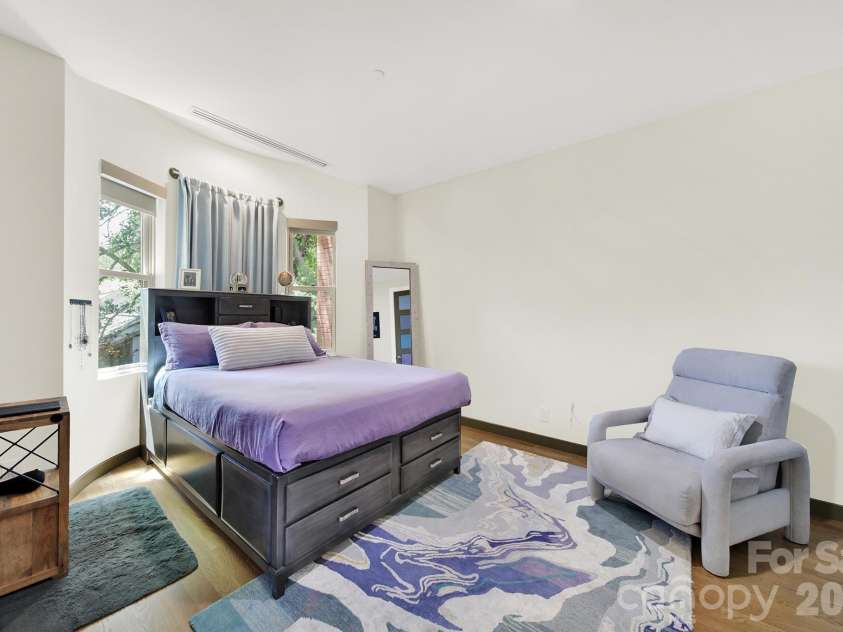 1930 Scott Avenue, Charlotte, NC 28203.  MLS# CAR4367127, YatesRealty ID 29105. Well-appointed third bedroom featuring neutral tones and plush layout.