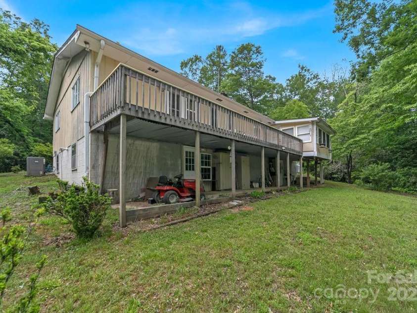 94 Sweetwater Lane, Pisgah Forest, NC 28768.  MLS# CAR4124609, YatesRealty ID 2911. Back of home