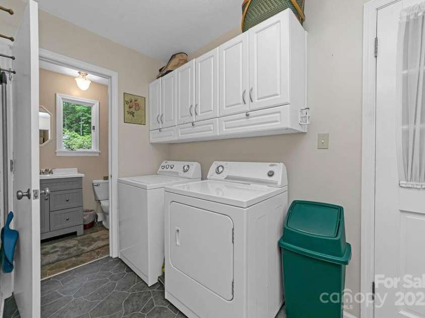 94 Sweetwater Lane, Pisgah Forest, NC 28768.  MLS# CAR4124609, YatesRealty ID 2911. Laundry and 1/2 bath